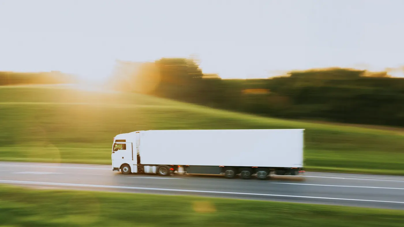 A white lorry passing at speed